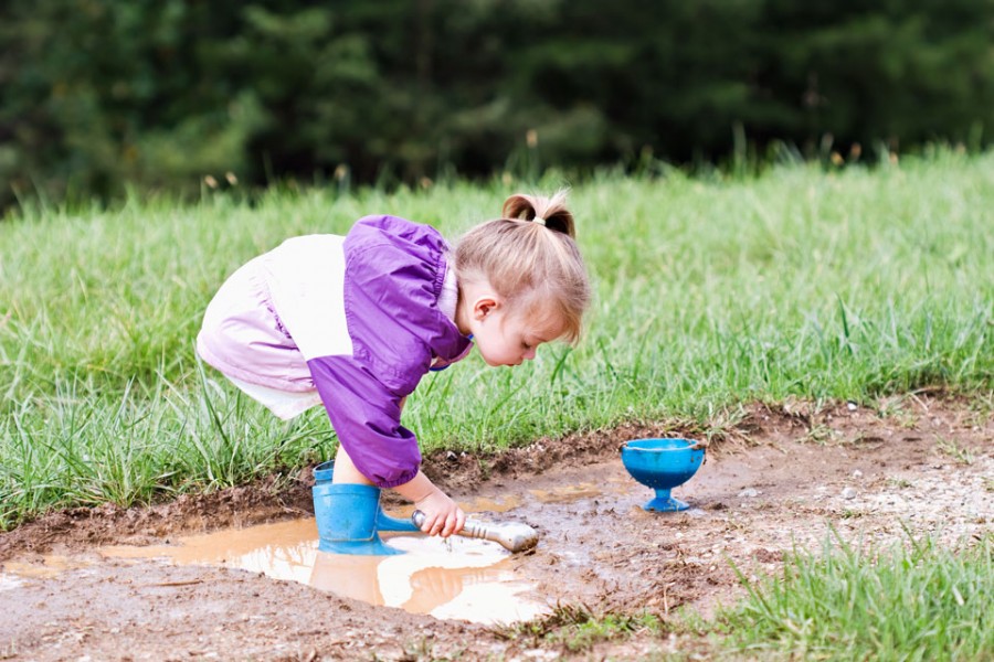 Toddler outdoor play in mud